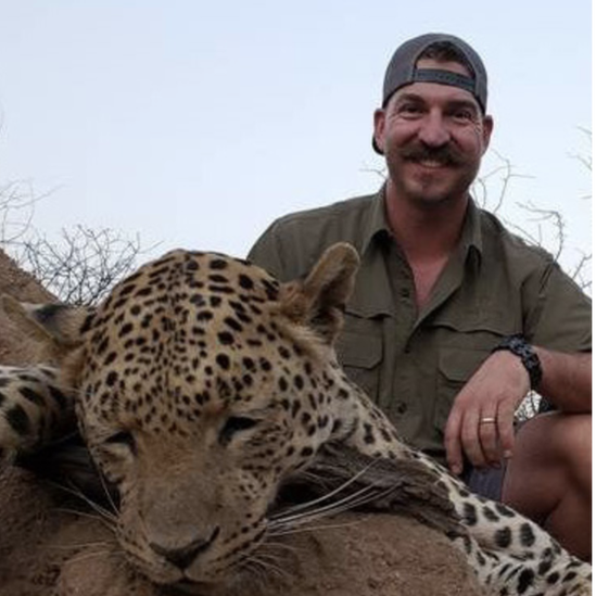 Mr Fischer posing with dead leopard