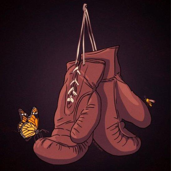 Picture of boxing gloves with butterfly and bee