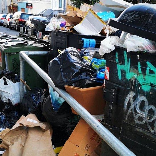 Rubbish loaded up by bins in St Pauls