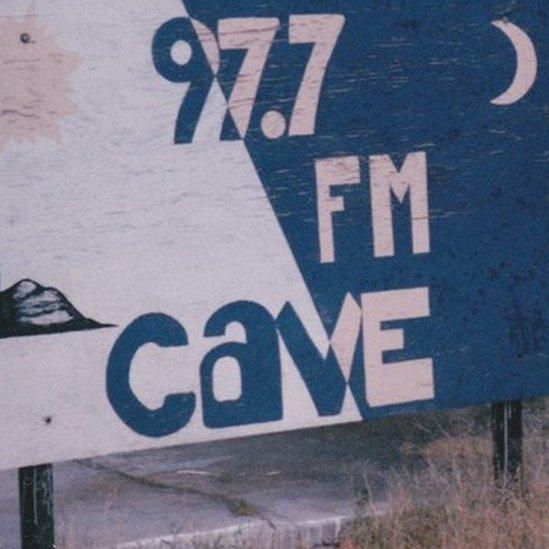 Cave 97.7 FM sign in Benson