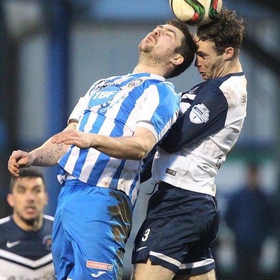 James McLaughlin of Coleraine and Ballinamallard United's Colm McLaughlin in action during the fifth round tie at the Showgrounds