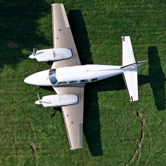 John Backhouse's Piper Navajo parked on his grass airstrip in Cheshire