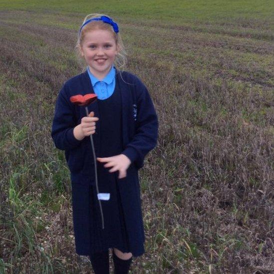 Edie Keates with one of the poppies