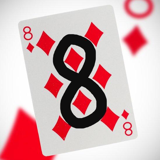 Playing card of eight of diamonds with the eight drawn onto it