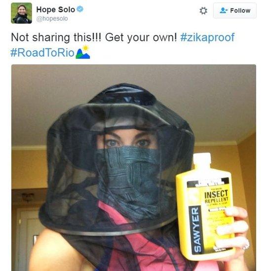 Screengrab of a picture posted by Hope Solo showing her wearing a hat with mosquito netting