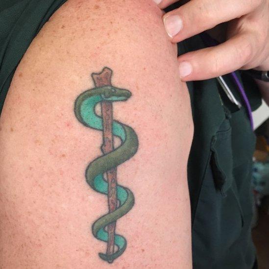 Graham's serpent tattoo