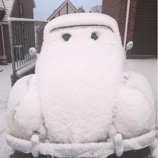 VW Beetle covered in snow