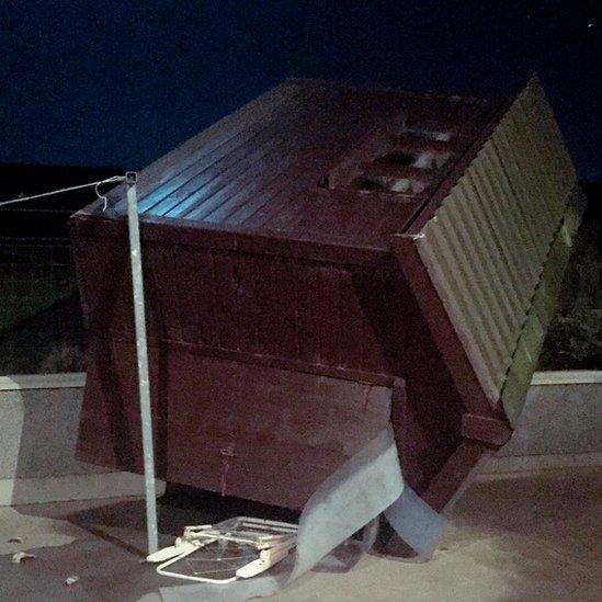 Garden shed blown over