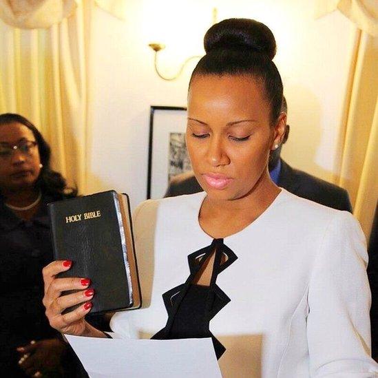 Anya Williams holds up a Bible as she is sworn in