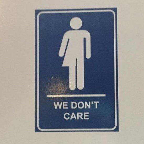 We don't care gender neutral bathroom sign