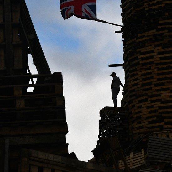 Preparations at the eleventh night bonfire at Donegall Road in Belfast