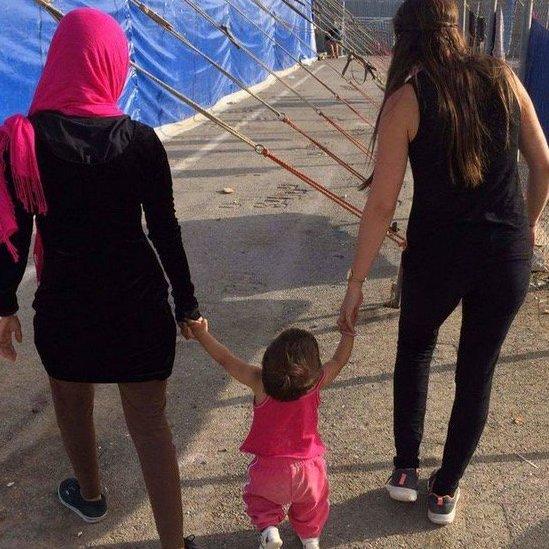 Lina Hussain, her daughter and a volunteer