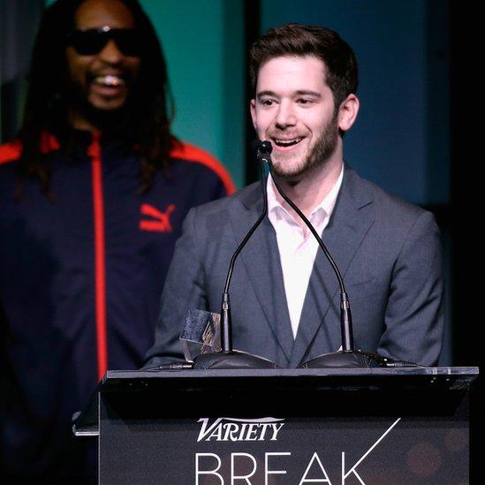 Honoree Colin Kroll (R) accepts the Breakthrough Award for Emerging Technology from rapper Lil Jon onstage at the Variety Breakthrough of the Year Awards