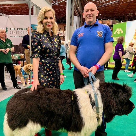 Pete Lewis and Sally Phillips with a newfoundland at Crufts