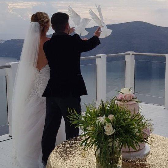 Sam and Laura release doves on their wedding day