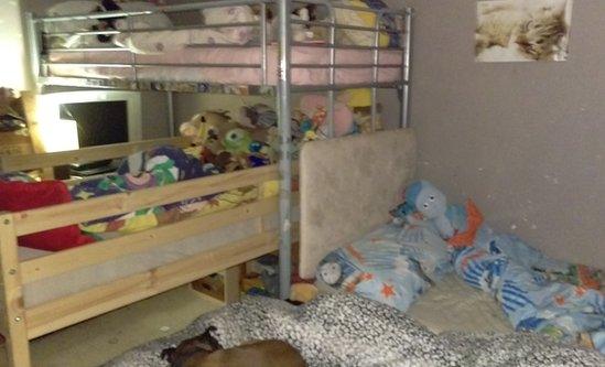 Three beds crammed into one bedroom