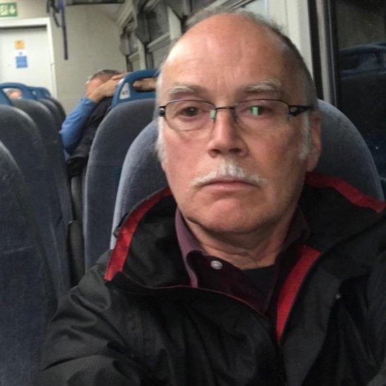 Phil Owen on a train