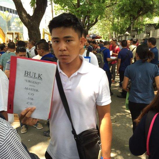 Man at informal jobs market in Manila / Photo: Charie Villa