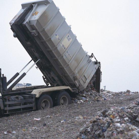 a lorry tipping landfill waste