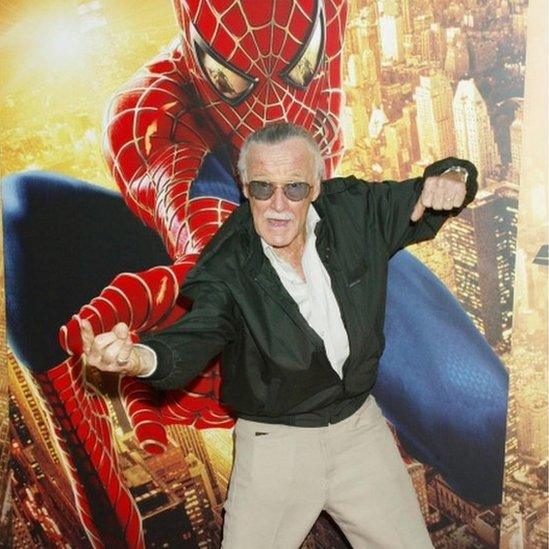 Lee poses with one of his best loved superheroes, Spider-Man, at the premiere of Spider-Man 2