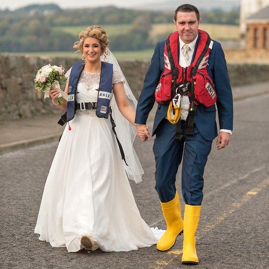 The couple posed for RNLI-themed photographs before the alarm was raised