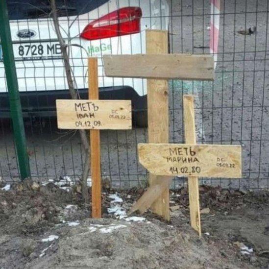 Makeshift grave of a mother and son in Irpin