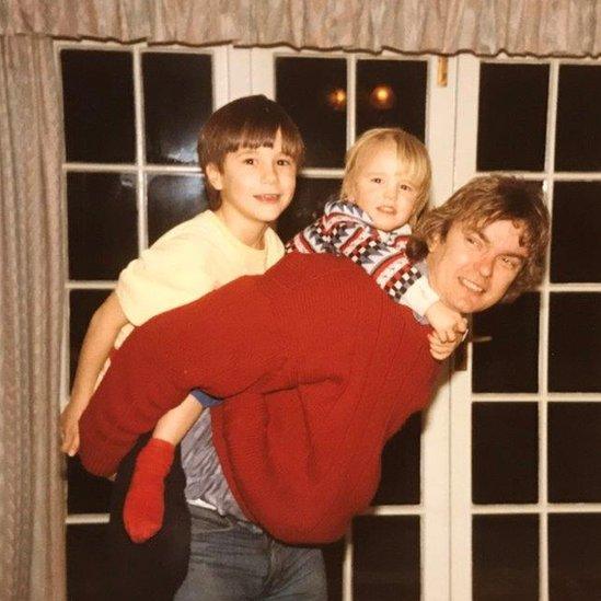 Richard with James (left) and David (centre) on his back