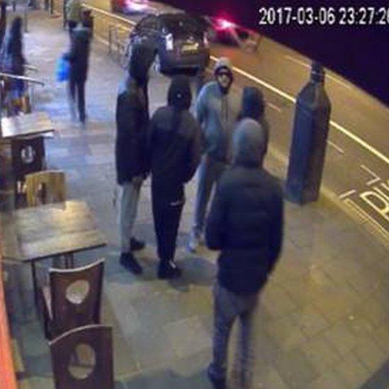 Gang outside Hackney shop