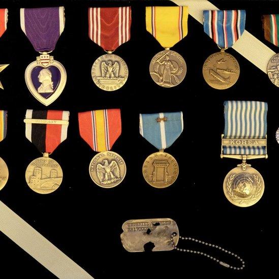 Colourful medals and the dog tag of Army Master Sgt Charles Hobert McDaniel