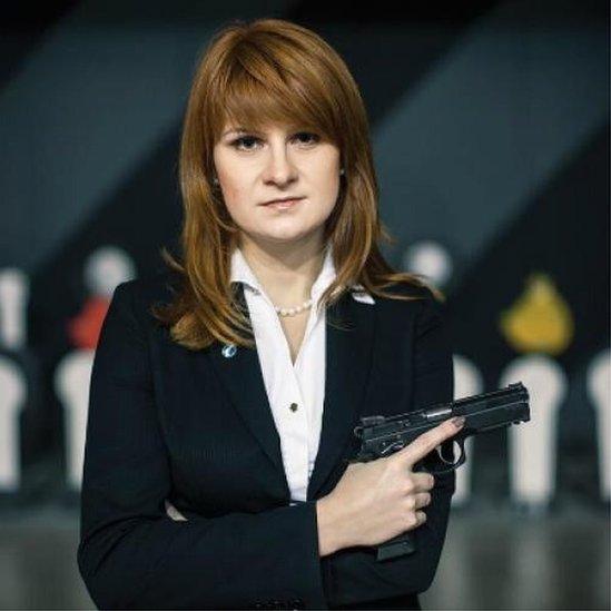 An undated handout picture showing Maria Butina posing with a gun