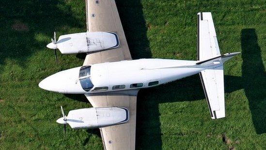 John Backhouse's Piper Navajo parked on his grass airstrip in Cheshire