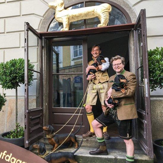 Museum curators with dachshunds