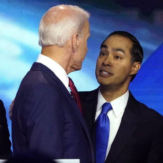 Mr Castro and Mr Biden shake hands after the debate