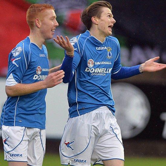 Paul McElroy looks almost apologetic after his intended cross went in off the post to give Dungannon Swifts the lead against Glentoran