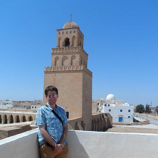 James Merriman in front of a tower in Kairouran