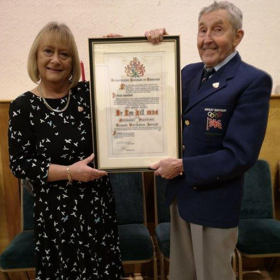 Ron Hill with certificate awarded for Freedom of the Borough of Tameside