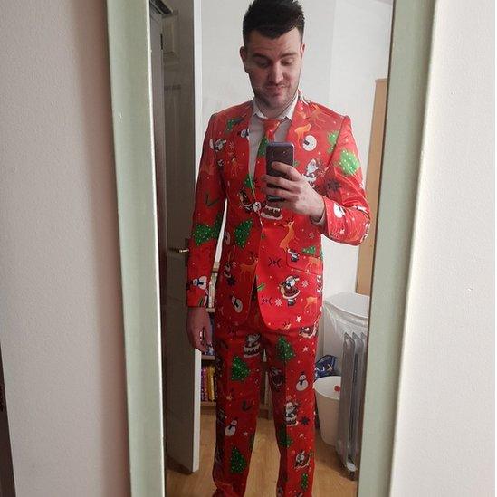 @TheSimonC90 wearing a Christmas-themed suit