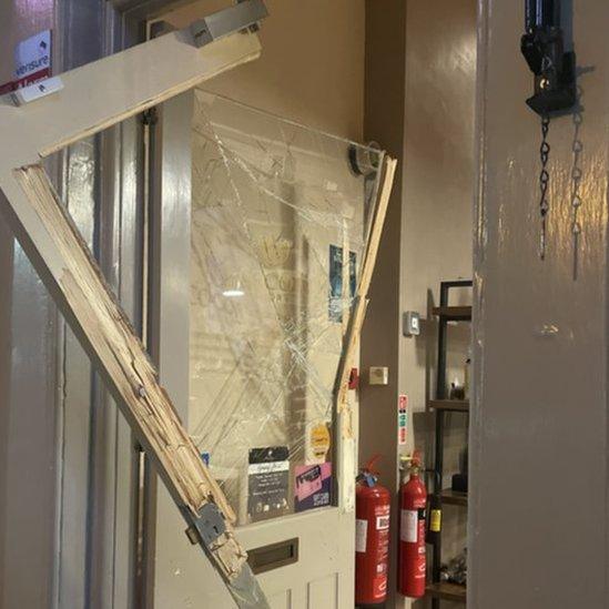 The smashed in door