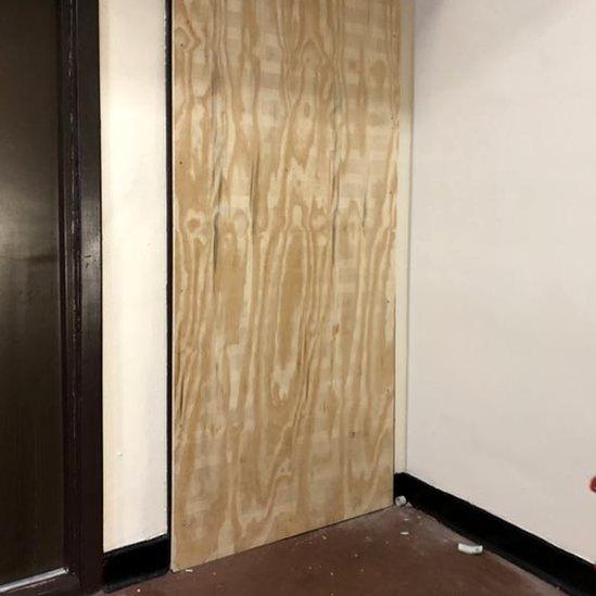 Michael Stewart's boarded up door