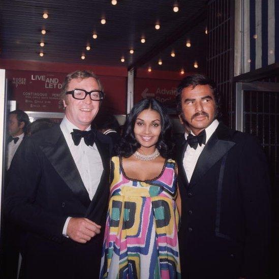 British actor Michael Caine, his wife Shakira, and Reynolds