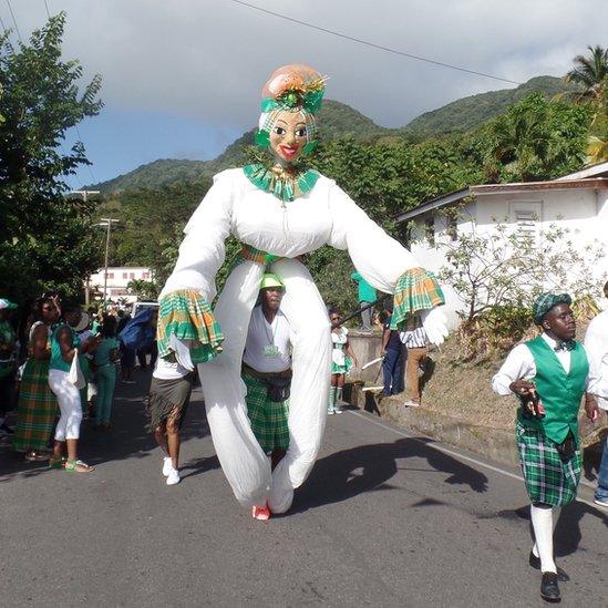 A puppet is carried along the route of the St Patrick's Day parade