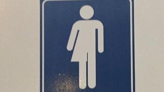 We don't care gender neutral bathroom sign