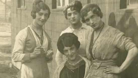 Male internees dressed as women for a performance