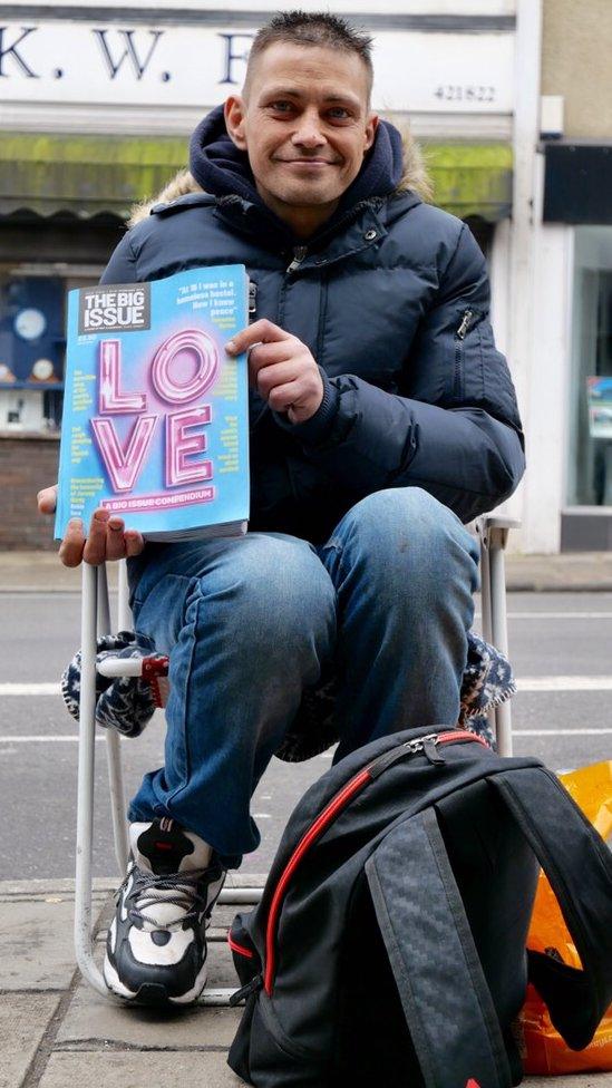 Dean selling the Big Issue on the side of the road