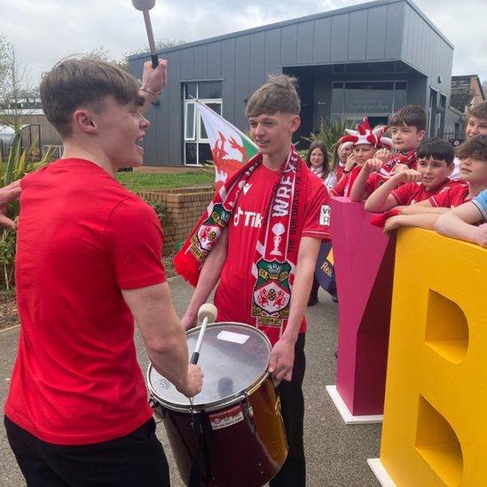 Mannie drums for fellow pupils at Ysgol Bryn Alyn in Gwersyllt