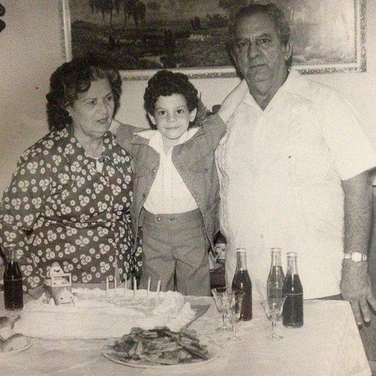 Fausto Oramas (centre) with grandparents