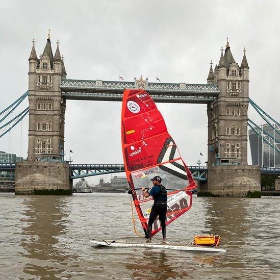 Mr Tinga windsurfing in front of Tower Bridge.