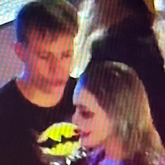 CCTV still of a couple dressed as Batman and Joker