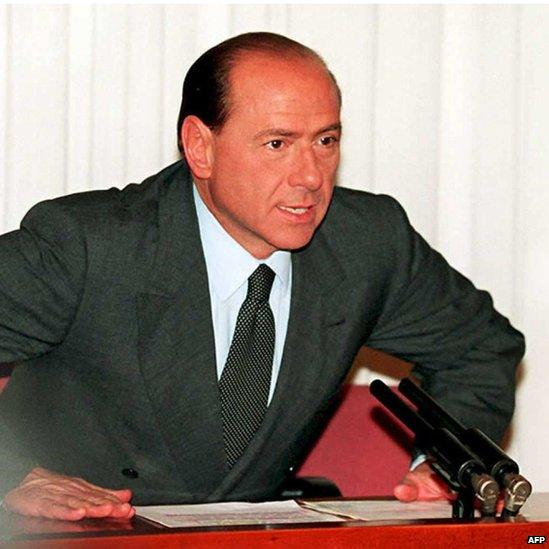 Silvio Berlusconi speaks to reporters in Rome after resigning as Italian prime minister, 22 December 1994