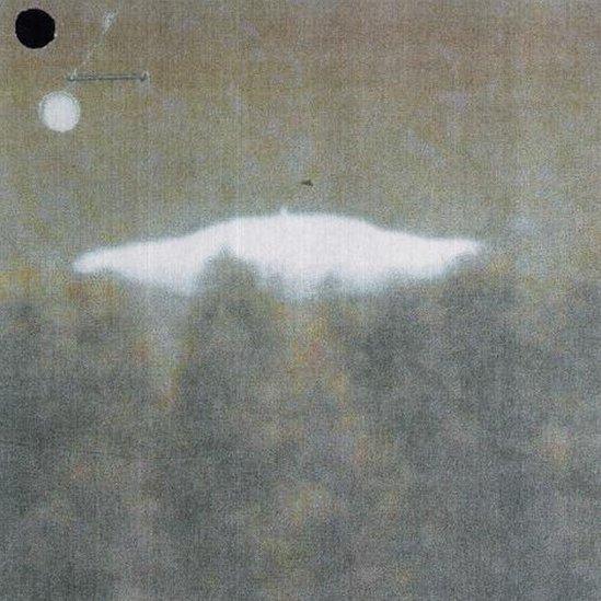 Photo of UFO above trees